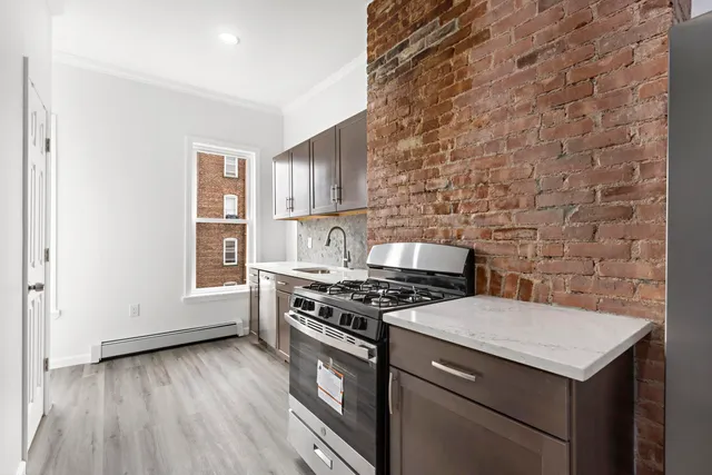 a kitchen with a stove and a microwave
