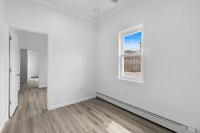 a view of wooden floor in an empty room
