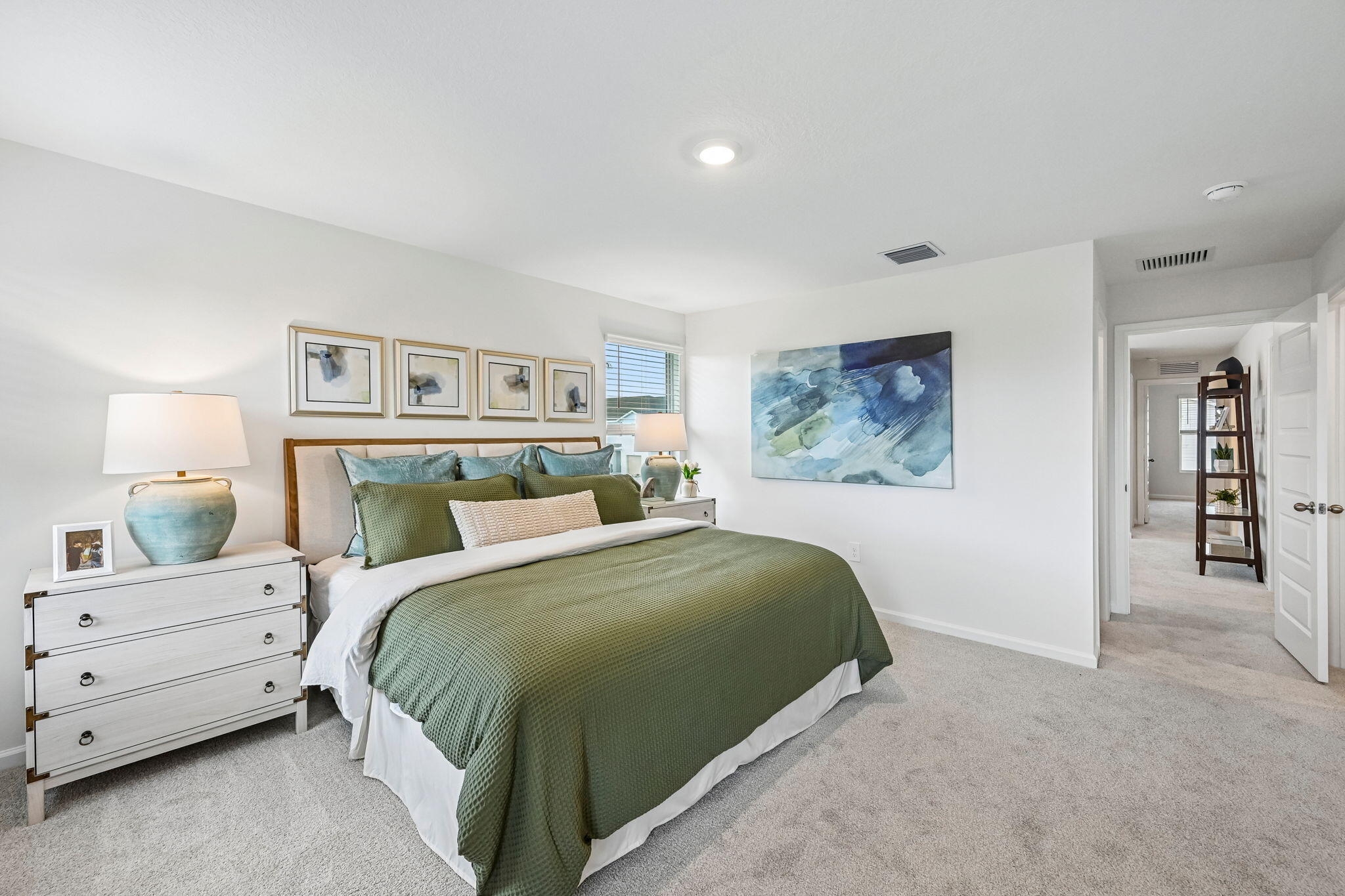 12957 Southwest Forli Way Port St. Lucie, FL 34987 - Photo 17 of 31 a bedroom with a bed and a night stand
