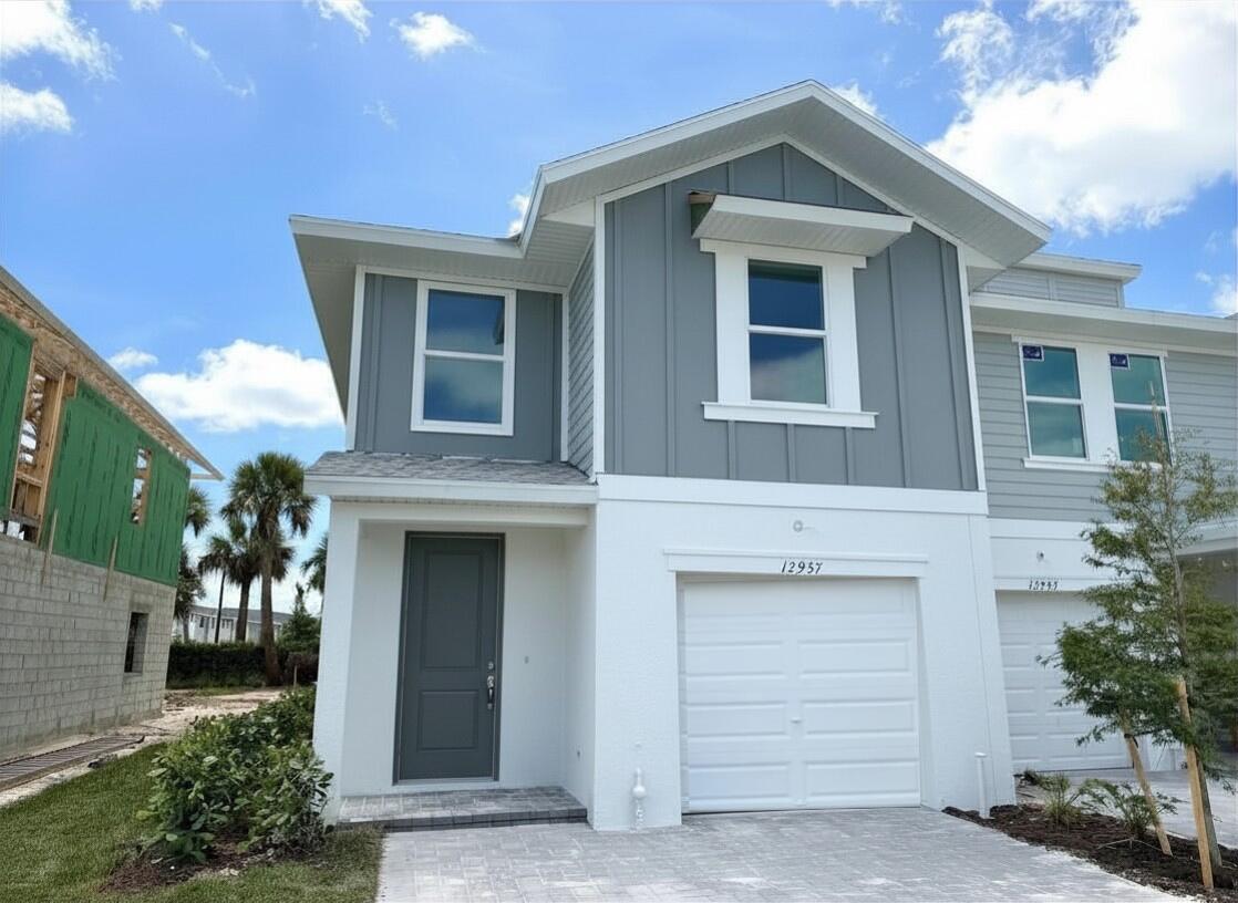 12957 Southwest Forli Way Port St. Lucie, FL 34987 - Photo 2 of 31 a front view of a house