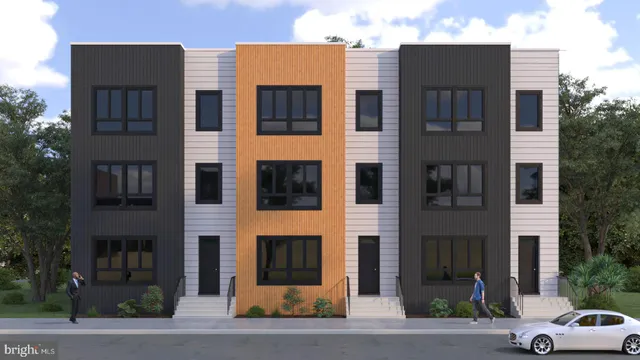 a couple of cars parked in front of brick building