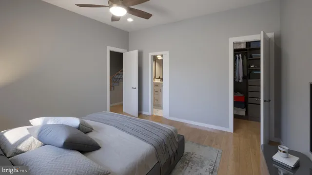 a bedroom with a bed and a ceiling fan