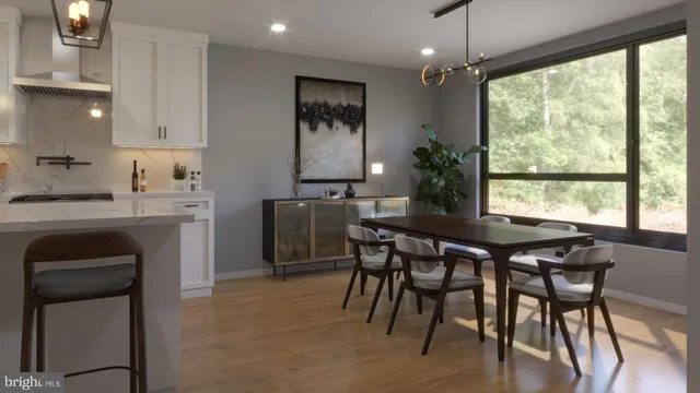 a kitchen with a table chairs sink and cabinets