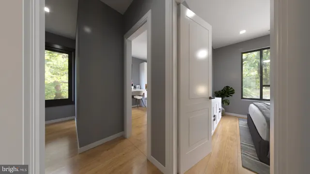 a living room with furniture a wooden floor and a large window