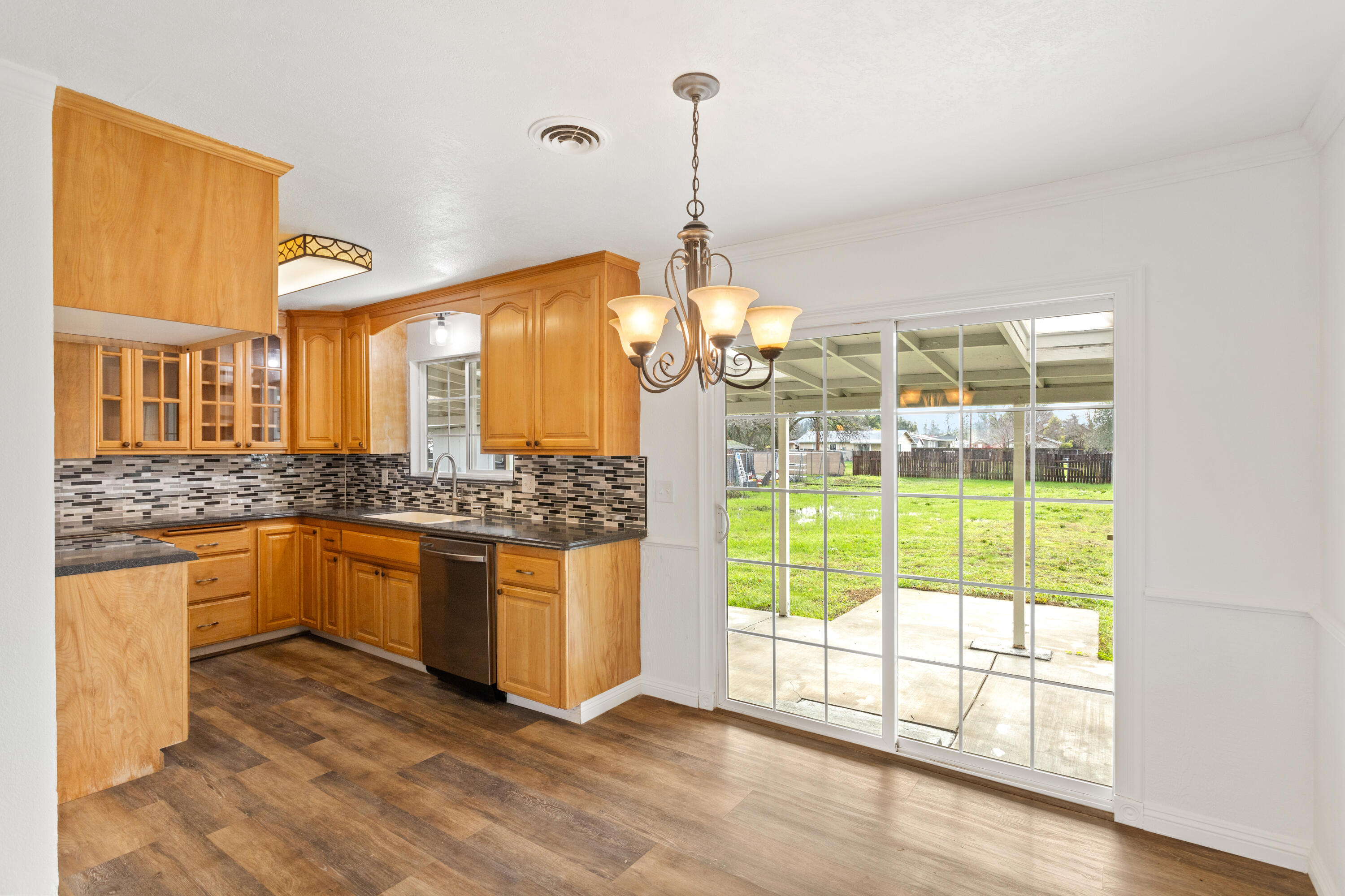 6973 Happy Valley Road Anderson, CA 96007 - Photo 18 of 36 a kitchen with stainless steel appliances granite countertop a stove and a sink