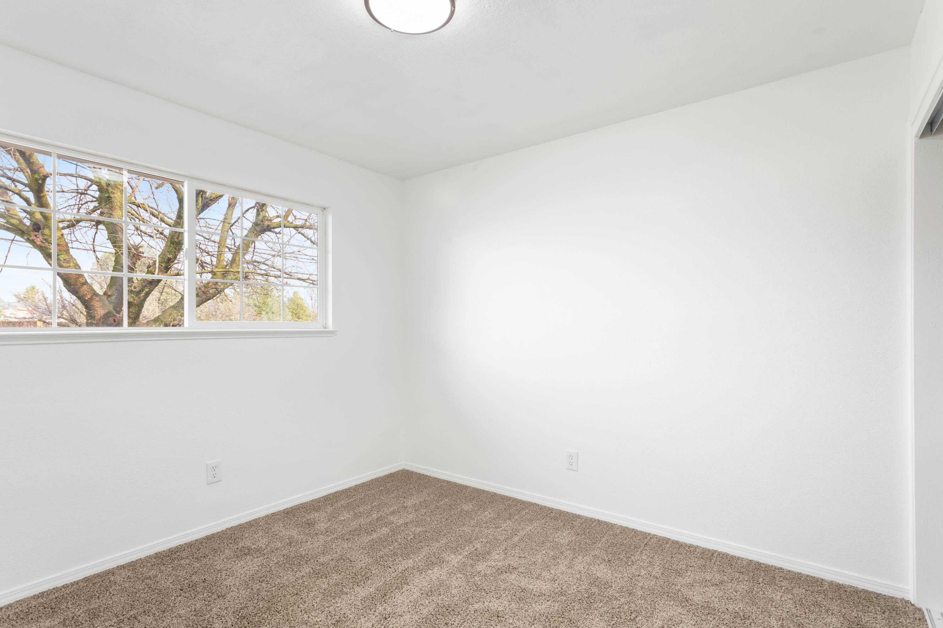 6973 Happy Valley Road Anderson, CA 96007 - Photo 20 of 36 a view of an empty room with a window