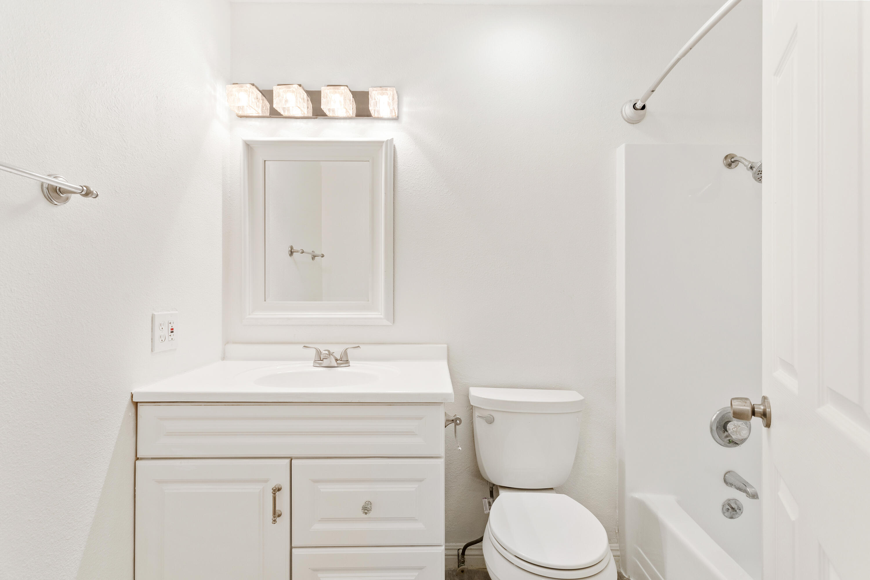 6973 Happy Valley Road Anderson, CA 96007 - Photo 22 of 36 a bathroom with a toilet sink vanity and mirror