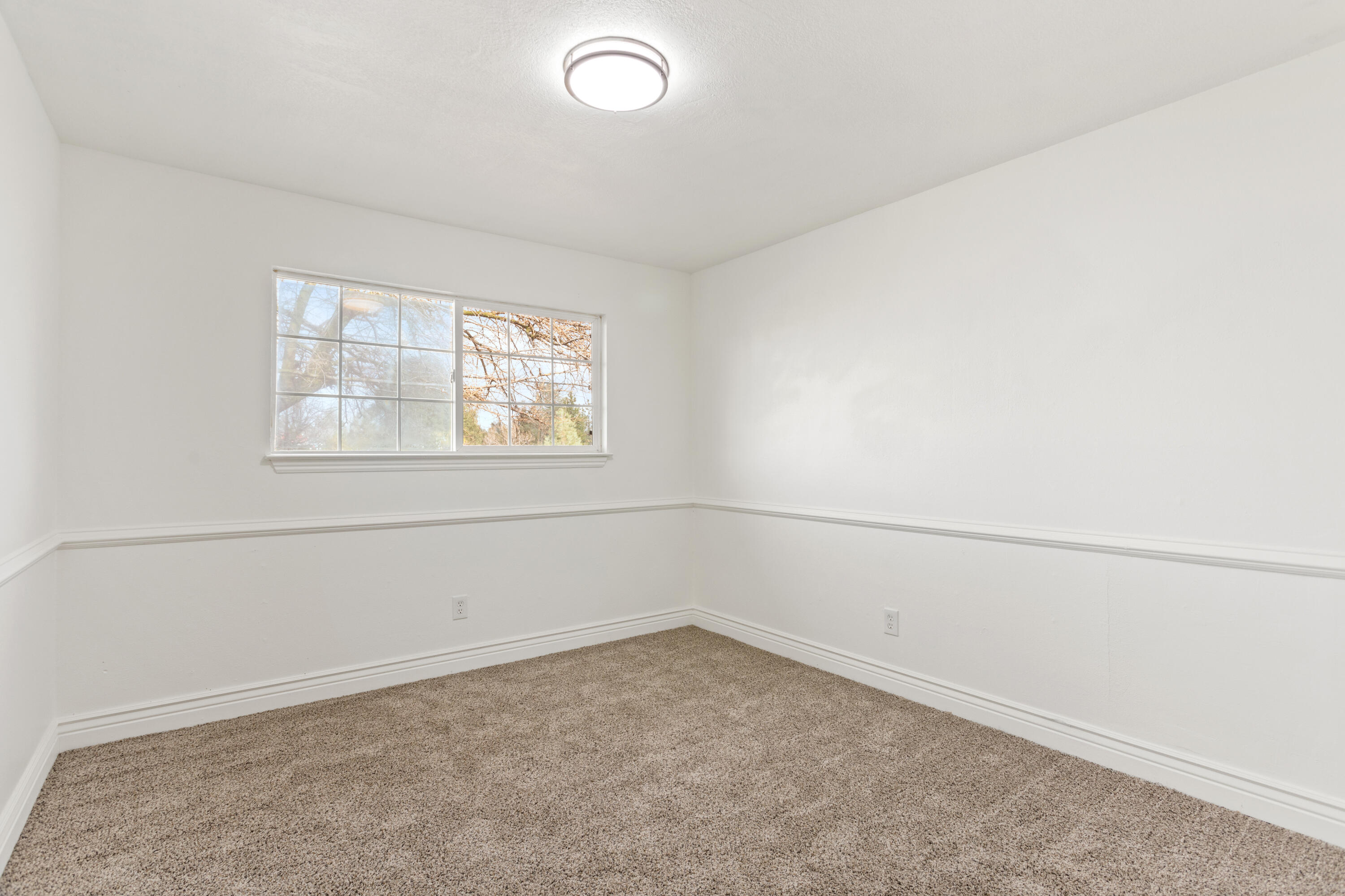 6973 Happy Valley Road Anderson, CA 96007 - Photo 26 of 36 an empty room with a window