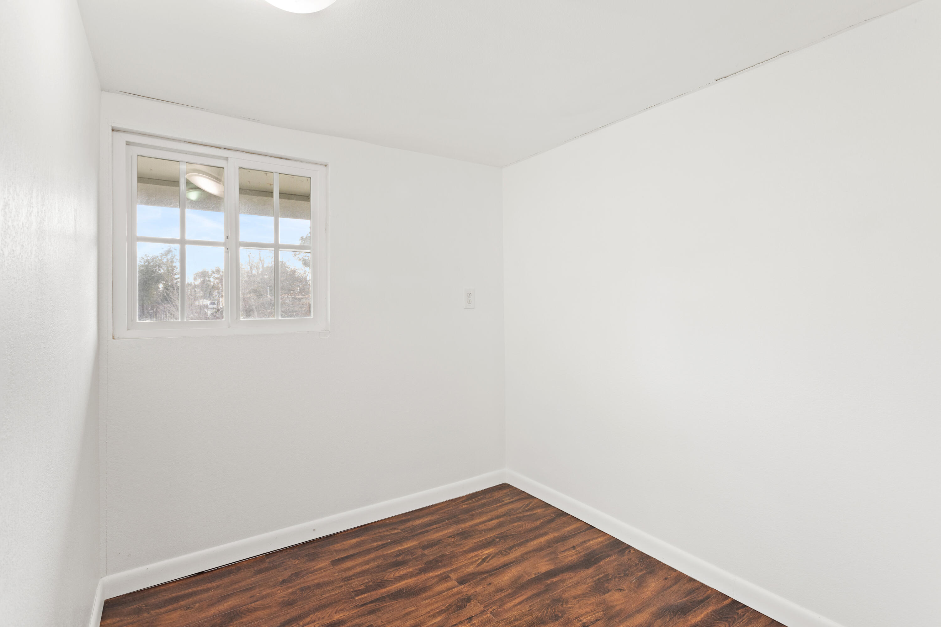 6973 Happy Valley Road Anderson, CA 96007 - Photo 31 of 36 a view of a small space with wooden floor and a window