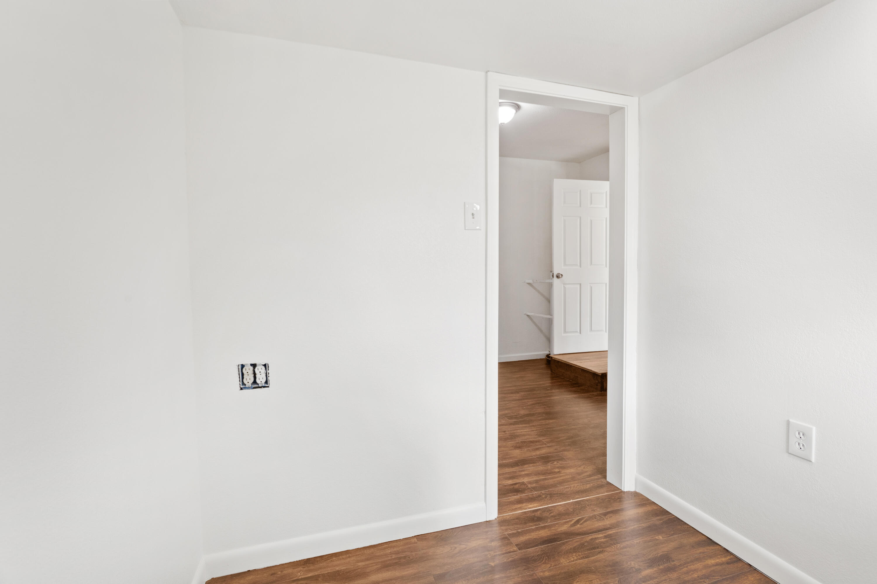 6973 Happy Valley Road Anderson, CA 96007 - Photo 32 of 36 a view of an empty room with wooden floor