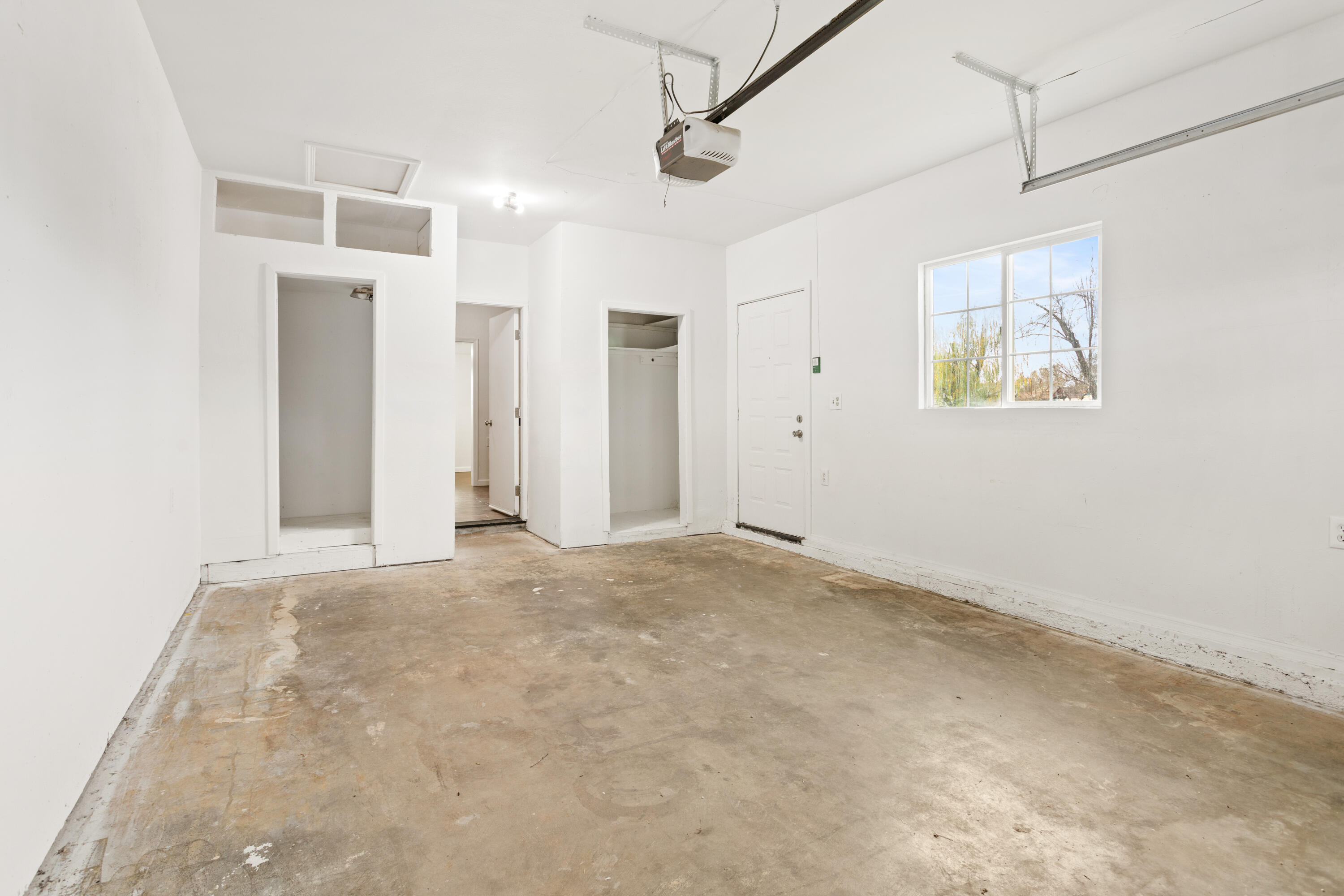 6973 Happy Valley Road Anderson, CA 96007 - Photo 34 of 36 an empty room with windows and closet