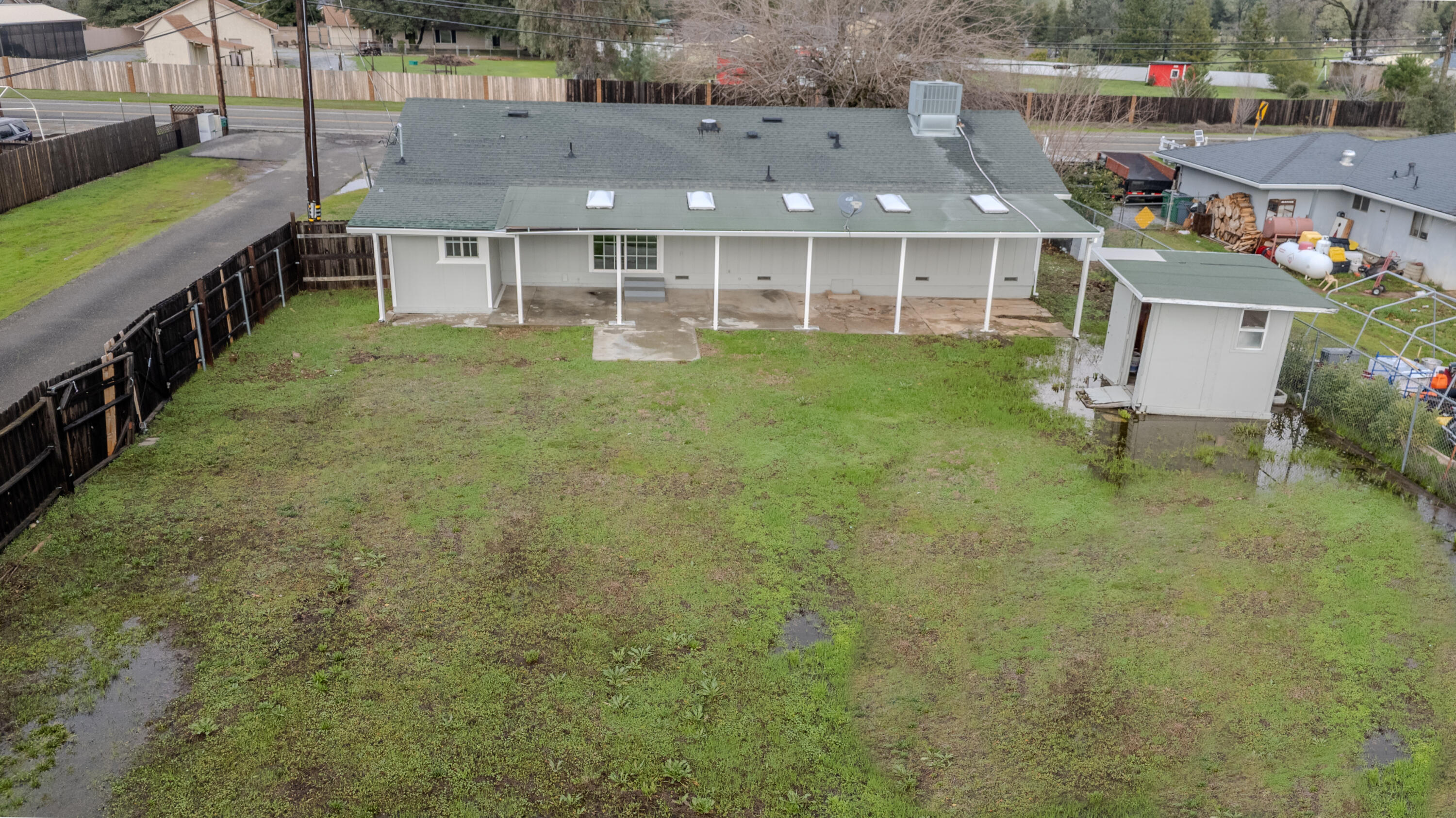 6973 Happy Valley Road Anderson, CA 96007 - Photo 4 of 36 a aerial view of a house with a yard patio and furniture