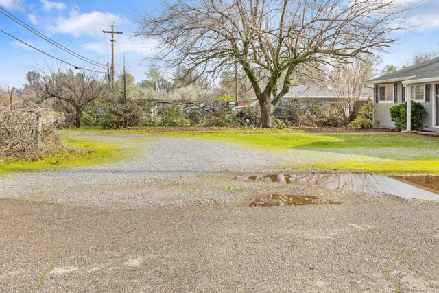 a view of a swimming pool with an outdoor space and seating area