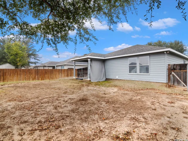 a house with trees in the background