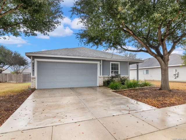 front view of a house with a bench