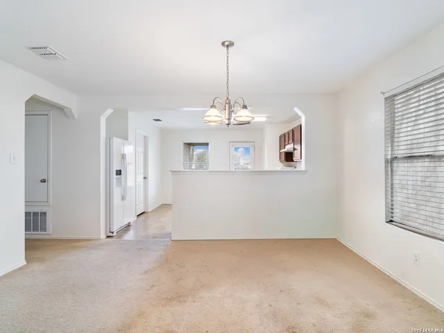 a view of a room with windows