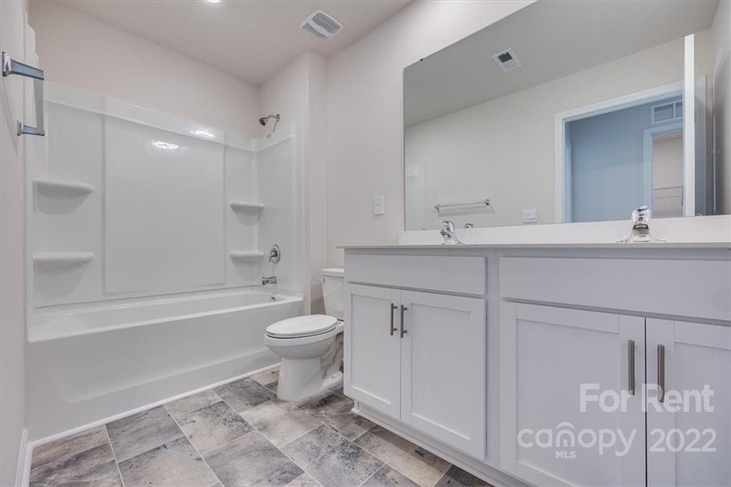 587 King Clover Lane Clover, SC 29710 - Photo 13 of 25 a bathroom with a sink toilet vanity and shower