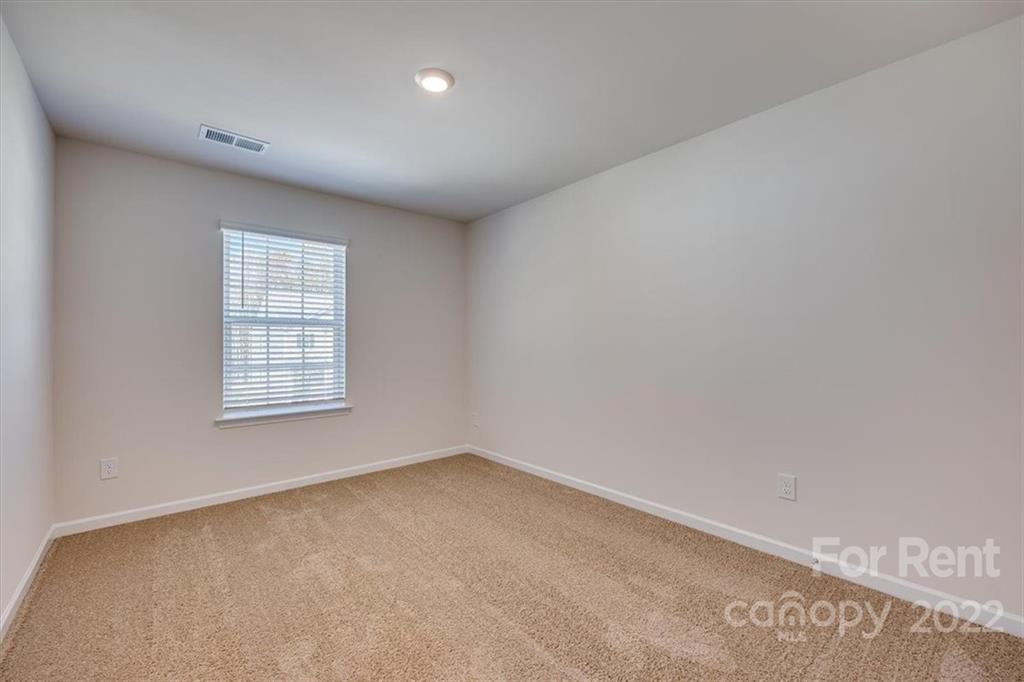 587 King Clover Lane Clover, SC 29710 - Photo 19 of 25 an empty room with a window
