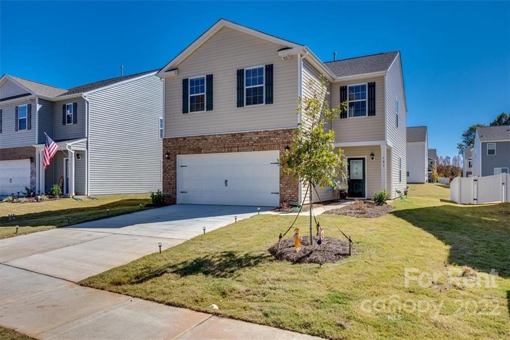 587 King Clover Lane Clover, SC 29710 - Photo 21 of 25 a front view of a house with a yard