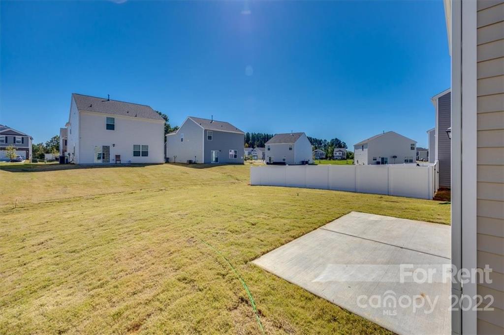 587 King Clover Lane Clover, SC 29710 - Photo 25 of 25 a swimming pool with an outdoor space and seating area