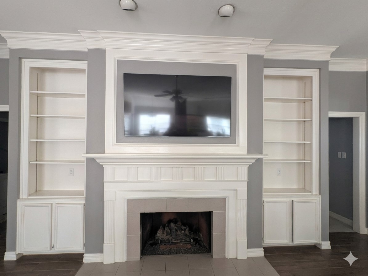 13107 Walnut Lake Road Houston, TX 77065 - Photo 7 of 21 a living room with a fireplace and a flat screen tv