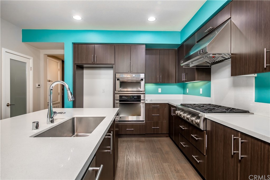 61 Gramercy Irvine, CA 92612 - Photo 12 of 21 a kitchen with a stove and a sink
