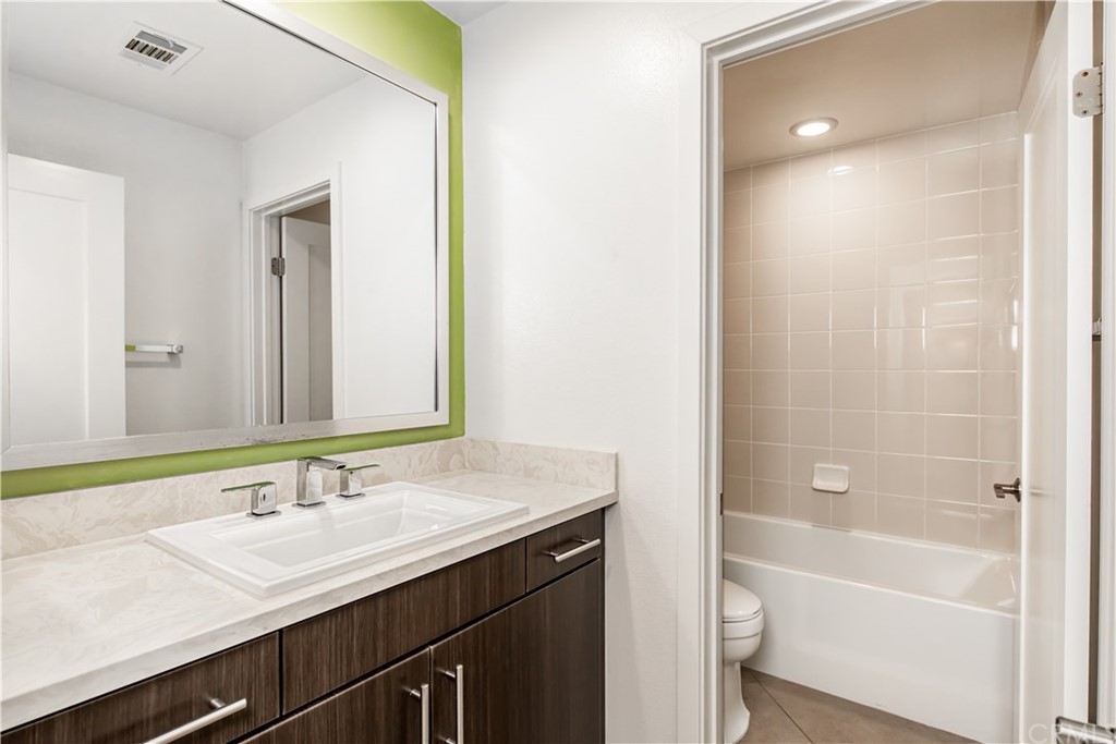 61 Gramercy Irvine, CA 92612 - Photo 15 of 21 a bathroom with a sink a toilet and shower