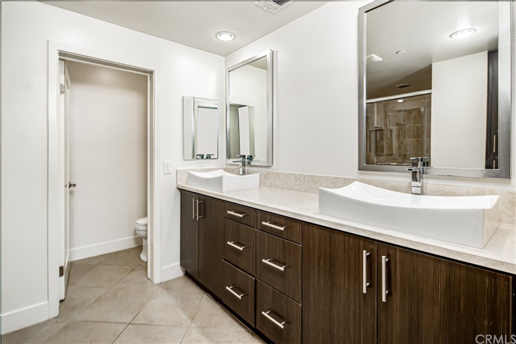 61 Gramercy Irvine, CA 92612 - Photo 17 of 21 a bathroom with a double vanity sink mirror and double