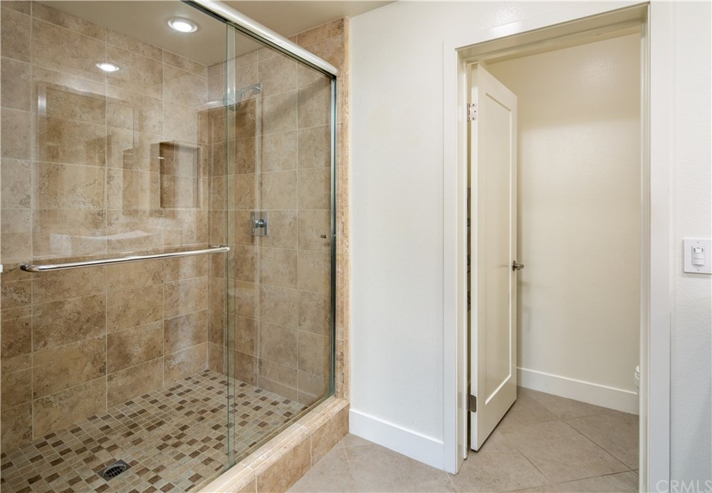 61 Gramercy Irvine, CA 92612 - Photo 18 of 21 a bathroom with a shower and a sink