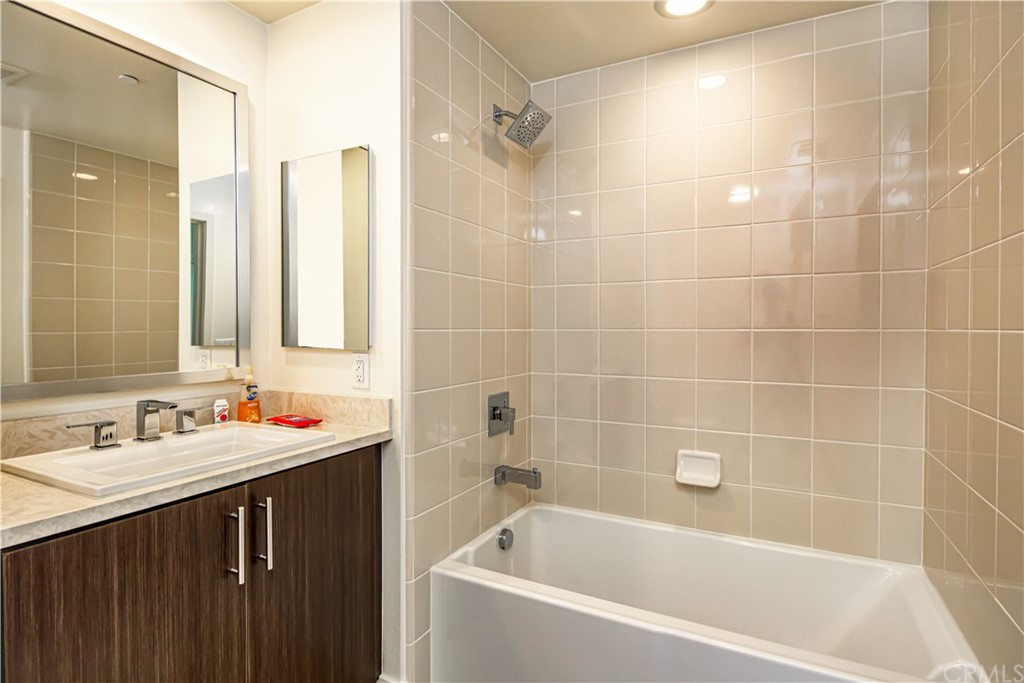 61 Gramercy Irvine, CA 92612 - Photo 6 of 21 a white bath tub sitting next to a bathroom sink