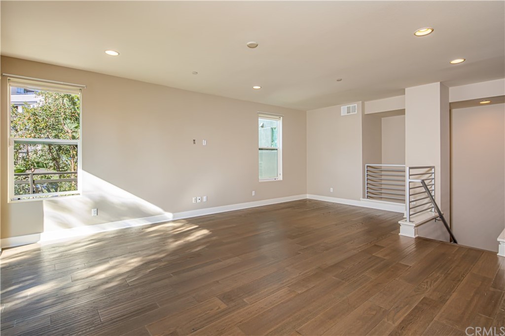 61 Gramercy Irvine, CA 92612 - Photo 9 of 21 a view of an empty room with wooden floor and a window