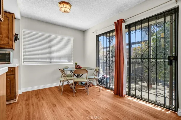 a view of a dining room with furniture and window