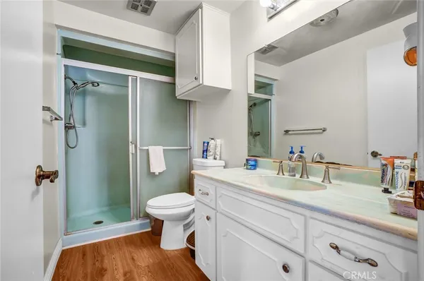 a bathroom with a sink a mirror and vanity