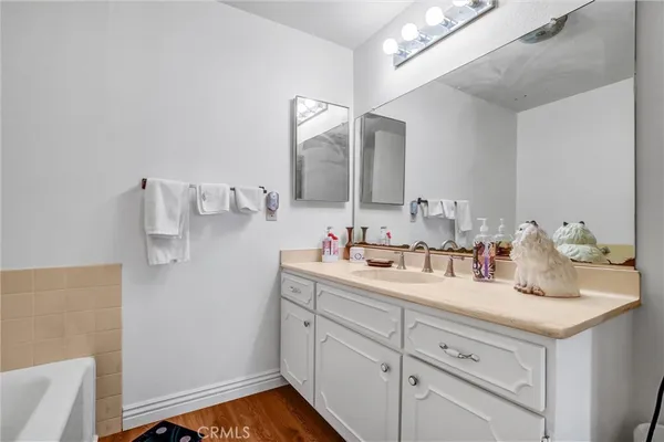 a view of balcony with wooden floor and fence