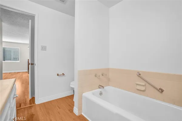 a balcony with furniture and a potted plant