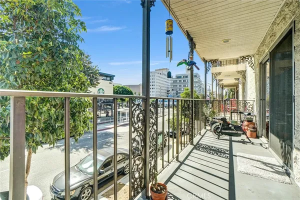 a view of parking garage with cars parked