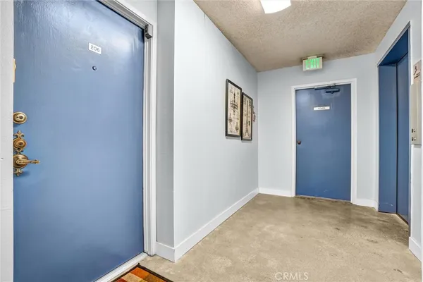 a view of an empty room with glass door