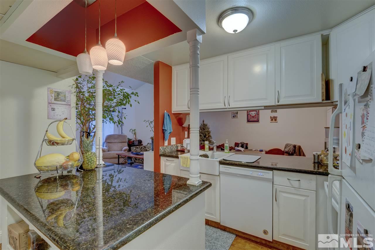 2700 Plumas Street, Unit 322 Reno, NV 89509 - Photo 12 of 18 a kitchen with sink refrigerator and cabinets