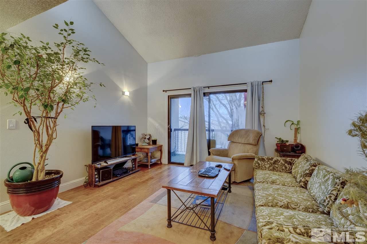 2700 Plumas Street, Unit 322 Reno, NV 89509 - Photo 15 of 18 a living room with furniture and a potted plant