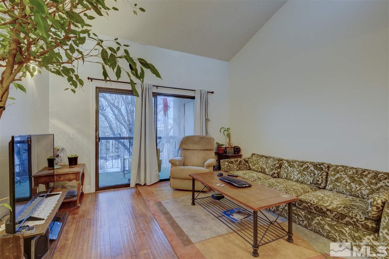 2700 Plumas Street, Unit 322 Reno, NV 89509 - Photo 16 of 18 a living room with furniture and a wooden floor