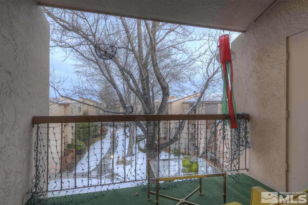 2700 Plumas Street, Unit 322 Reno, NV 89509 - Photo 17 of 18 a view of a balcony with furniture and wooden deck