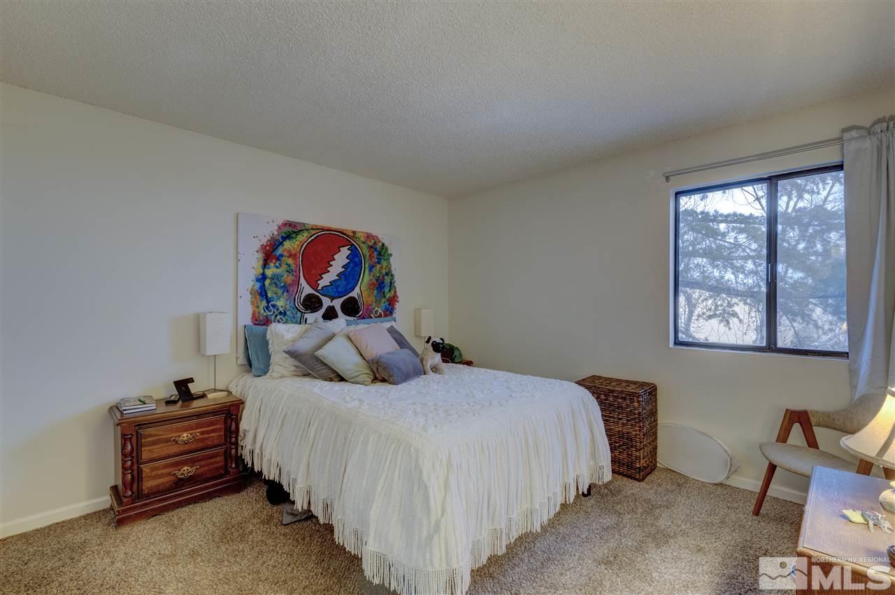 2700 Plumas Street, Unit 322 Reno, NV 89509 - Photo 8 of 18 a bedroom with a bed and dresser