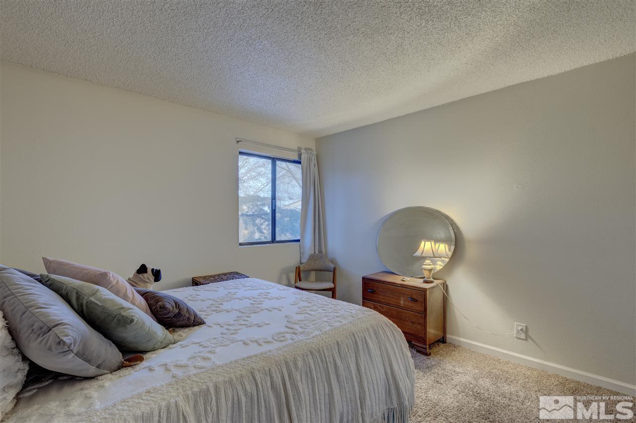 2700 Plumas Street, Unit 322 Reno, NV 89509 - Photo 9 of 18 a bedroom with a bed and window