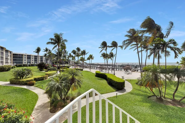 a view of swimming pool with outdoor seating and plants