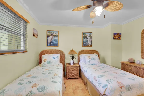 a bathroom with a granite countertop sink a mirror and a toilet