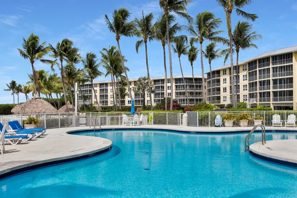 a view of a swimming pool with a patio