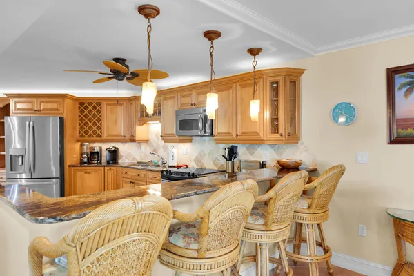 a kitchen with a table and chairs in it