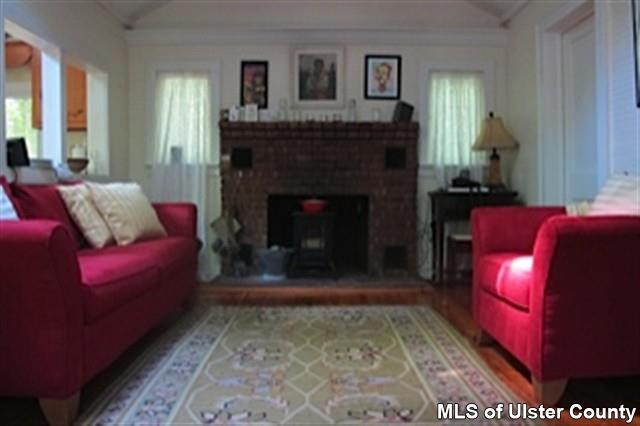 20 Sherman Road Woodstock, NY 12498 - Photo 12 of 17 a living room with furniture and a fireplace