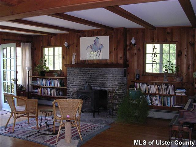 20 Sherman Road Woodstock, NY 12498 - Photo 4 of 17 a living room with furniture a window and a fireplace