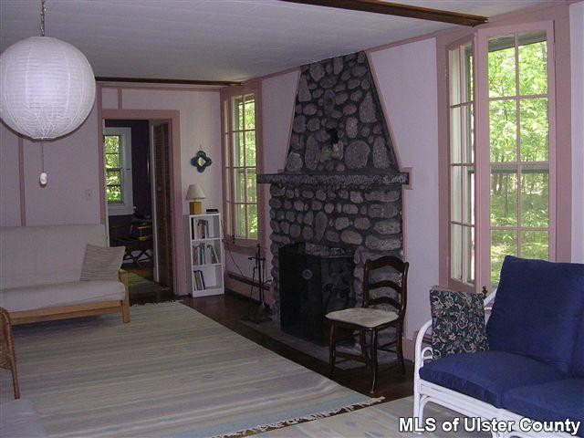 20 Sherman Road Woodstock, NY 12498 - Photo 6 of 17 a living room with furniture a window and a fireplace